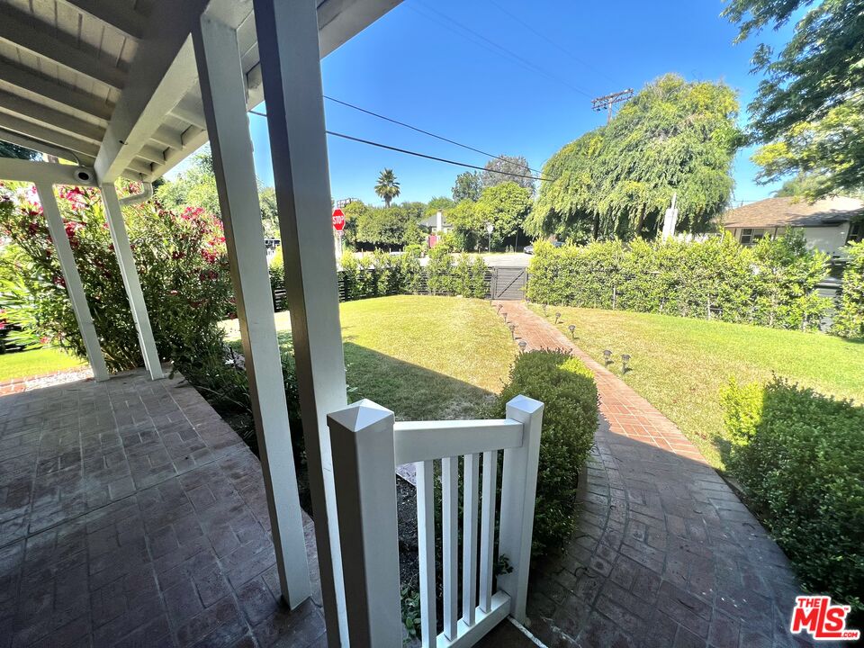 5757 Vesper Avenue Van Nuys, CA 91411 - Photo 21 of 26 a view of a balcony with floor to ceiling windows with wooden floor