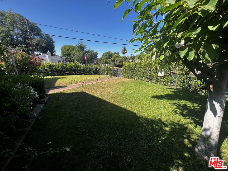 5757 Vesper Avenue Van Nuys, CA 91411 - Photo 22 of 26 a view of an outdoor space and a yard