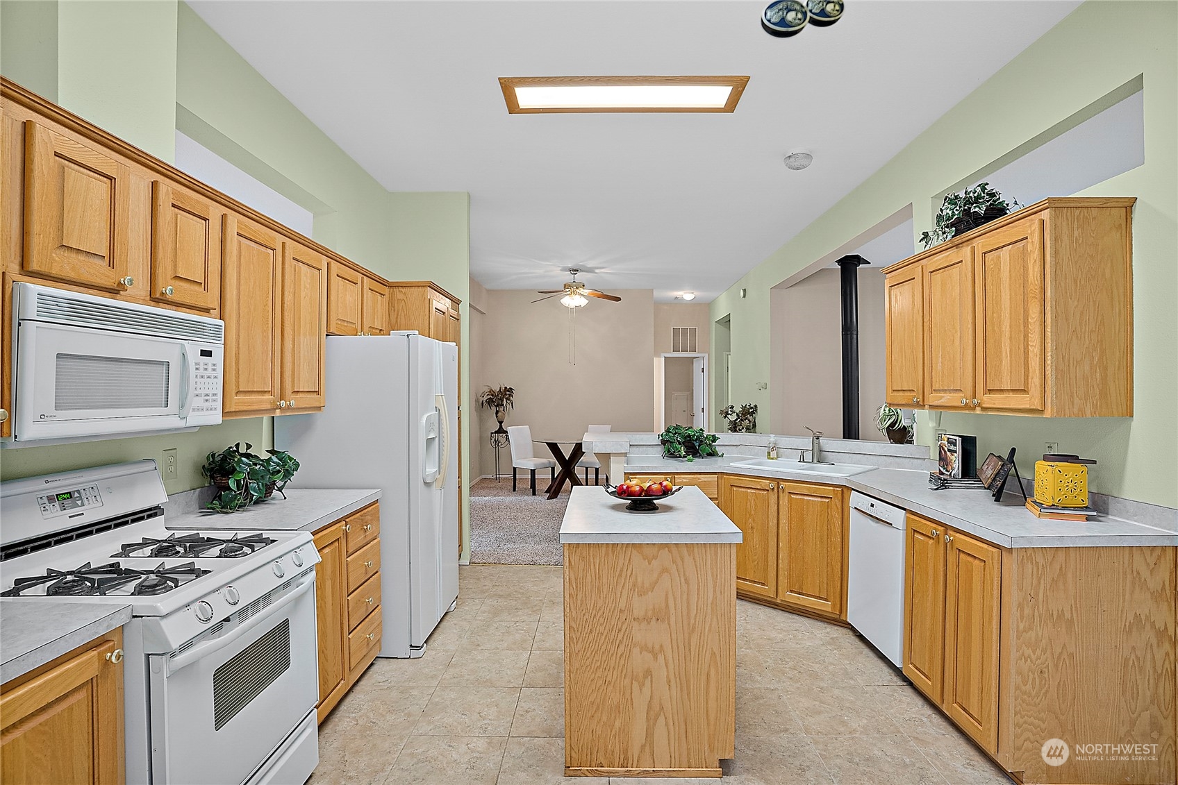 1230 East Jared Road Shelton, WA 98584 - Photo 17 of 40 a kitchen with a stove a sink dishwasher and a refrigerator