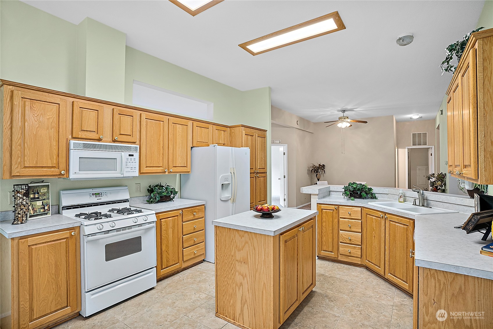 1230 East Jared Road Shelton, WA 98584 - Photo 18 of 40 a kitchen with stainless steel appliances a stove a sink and a refrigerator