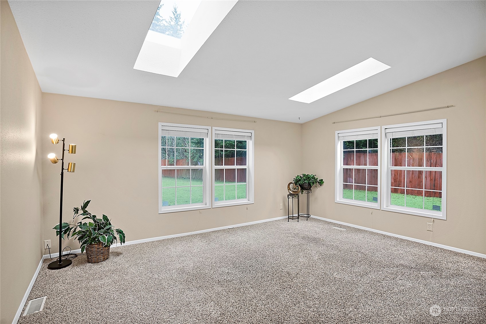 1230 East Jared Road Shelton, WA 98584 - Photo 22 of 40 a view of an empty room with a window and potted plants