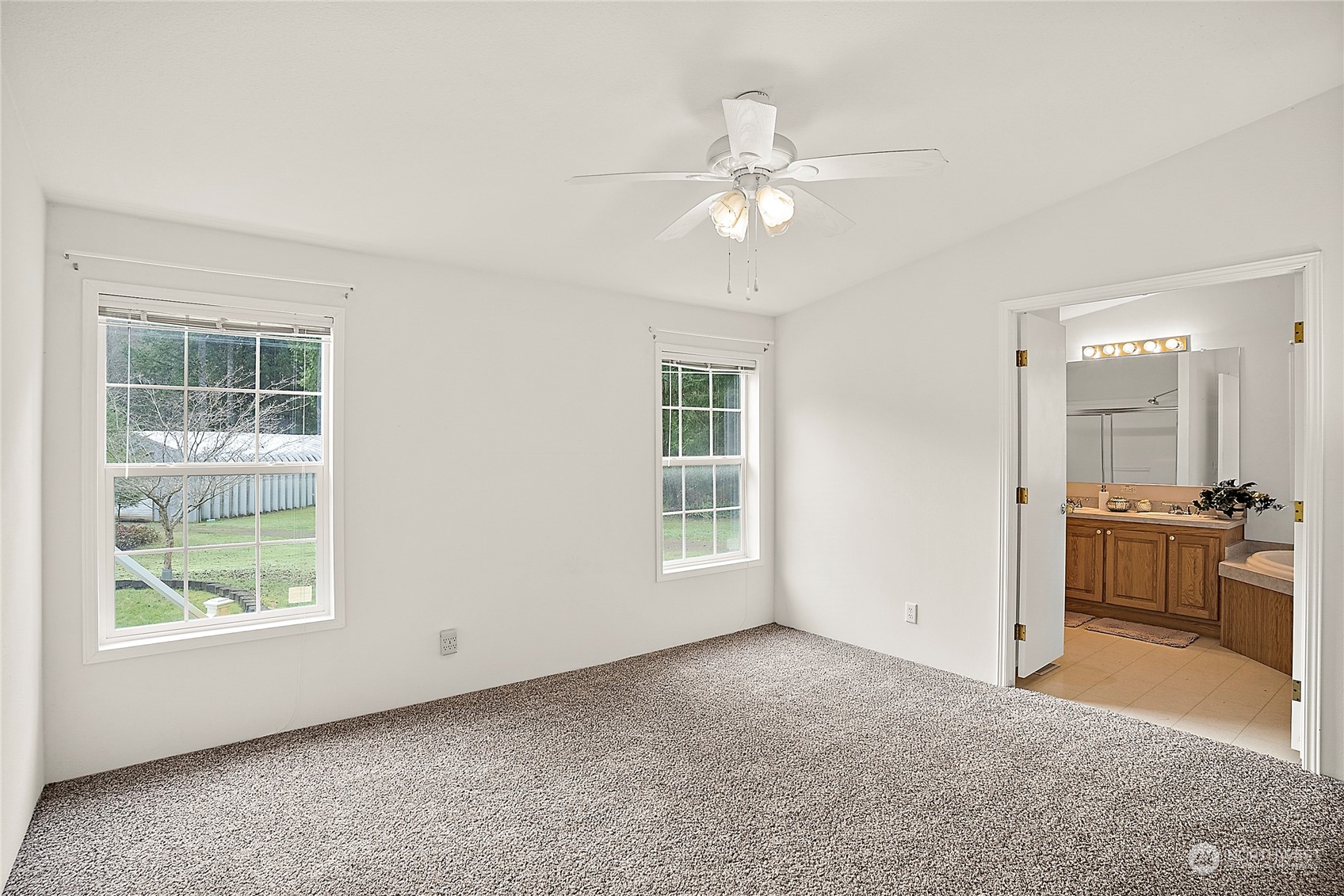 1230 East Jared Road Shelton, WA 98584 - Photo 28 of 40 an empty room with windows and ceiling fan