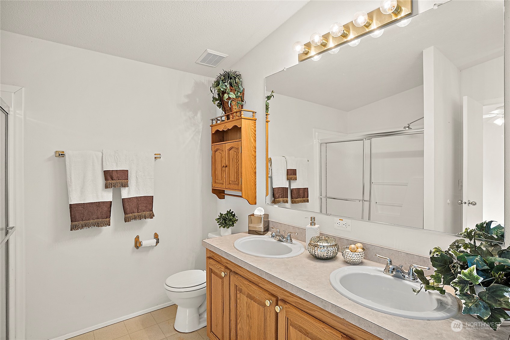 1230 East Jared Road Shelton, WA 98584 - Photo 30 of 40 a bathroom with a granite countertop sink a mirror and a toilet