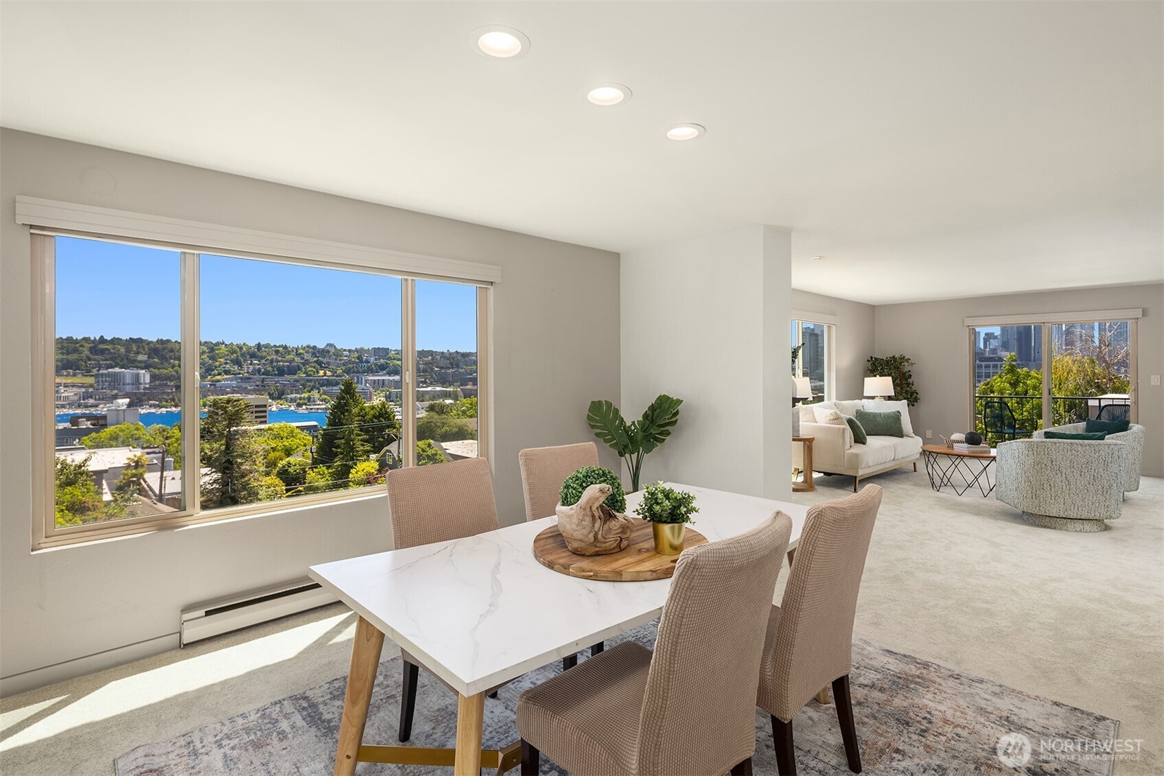 a dining room with furniture window and wooden floor