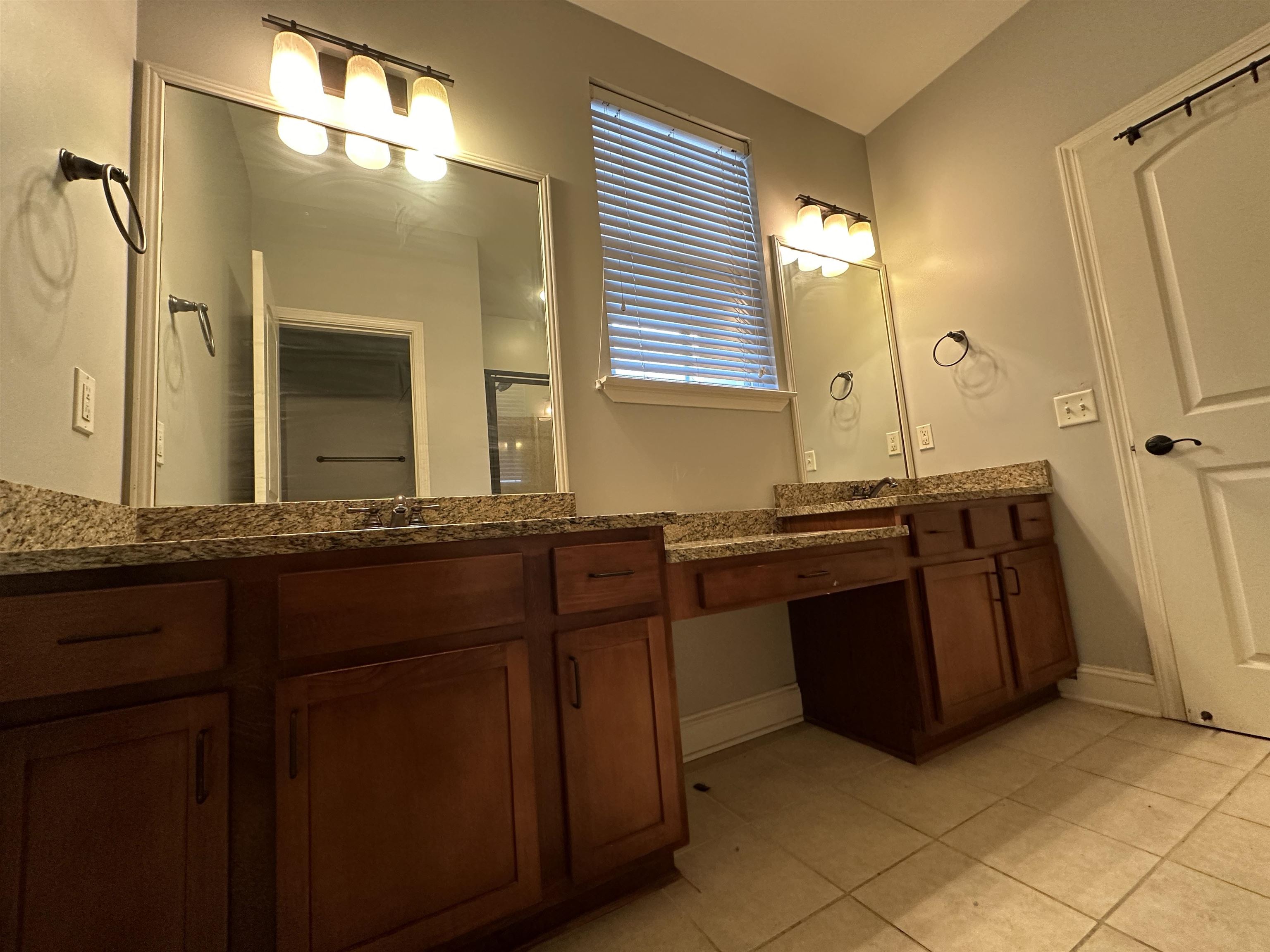 75 Shoemaker Court, Unit 304 Memphis, TN 38103 - Photo 12 of 25 Bathroom featuring tile flooring and dual vanity