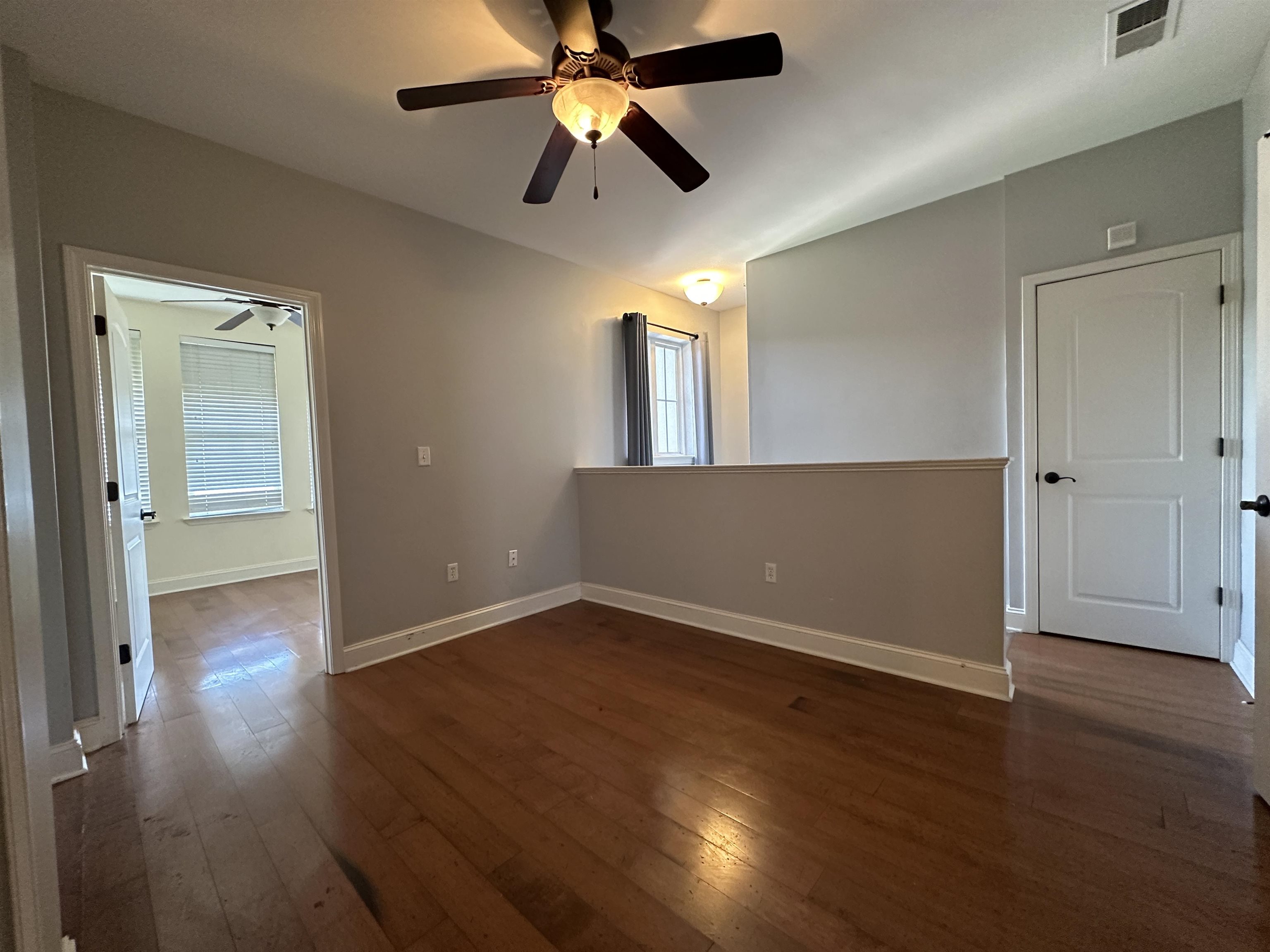 75 Shoemaker Court, Unit 304 Memphis, TN 38103 - Photo 15 of 25 Unfurnished room featuring dark hardwood / wood-style floors and ceiling fan