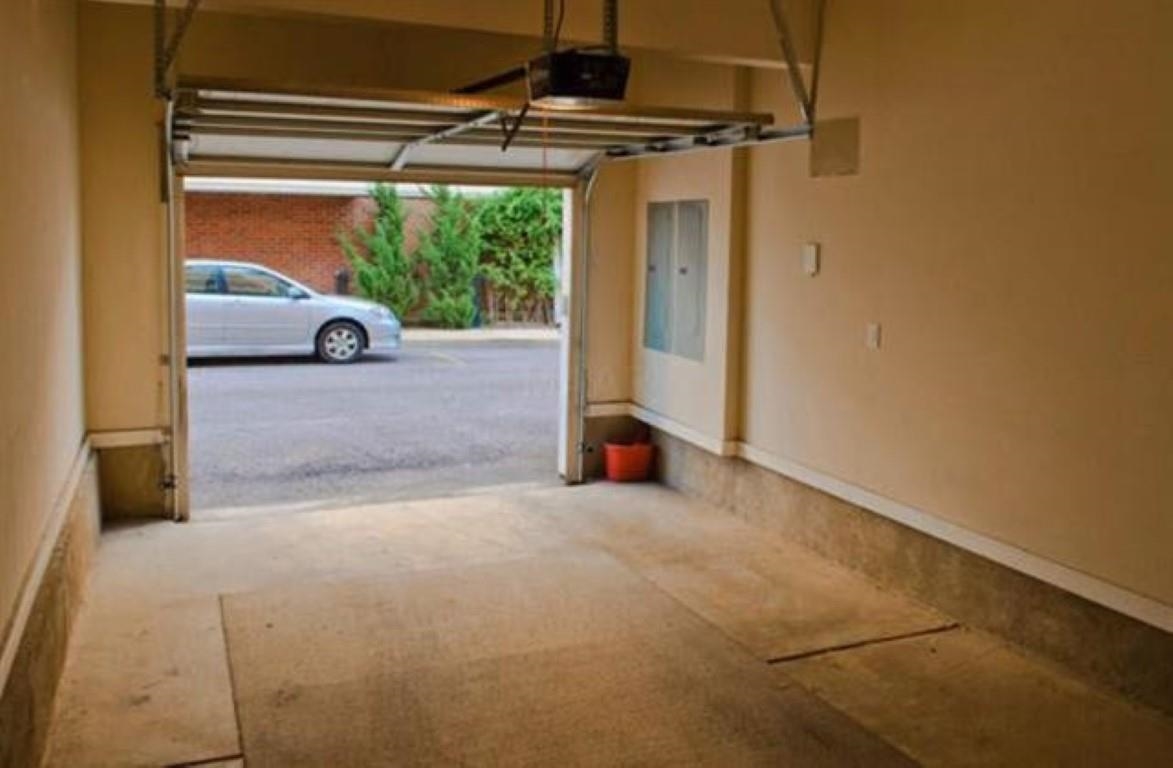 75 Shoemaker Court, Unit 304 Memphis, TN 38103 - Photo 21 of 25 Garage with a garage door opener
