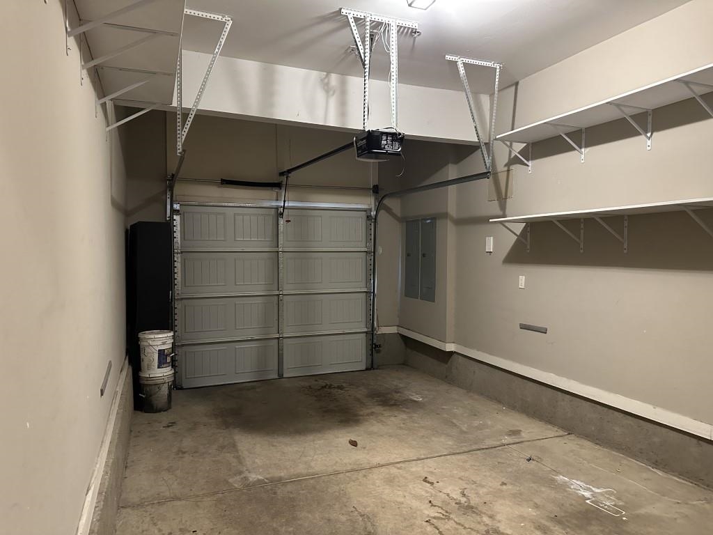 75 Shoemaker Court, Unit 304 Memphis, TN 38103 - Photo 22 of 25 Garage featuring a garage door opener