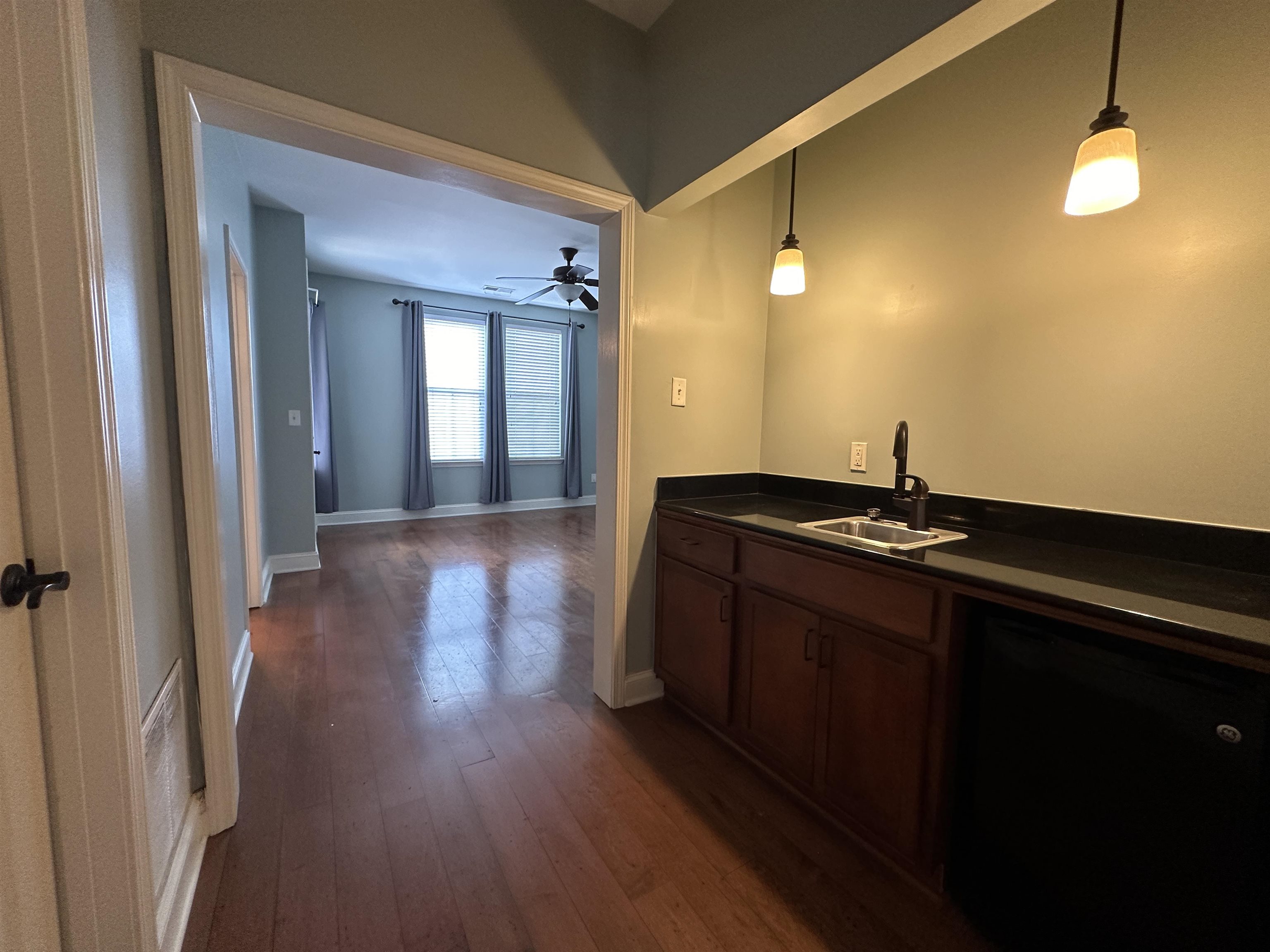 75 Shoemaker Court, Unit 304 Memphis, TN 38103 - Photo 9 of 25 Kitchen with ceiling fan, pendant lighting, dark wood-type flooring, black dishwasher, and sink