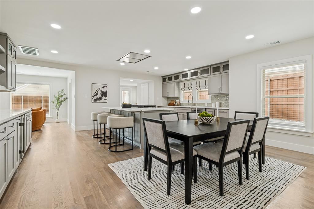 2006 Marydale Road Dallas, TX 75208 - Photo 12 of 40 Open-concept kitchen and dining area featuring light wood-finish flooring, recessed lighting, white walls, and light gray cabinetry