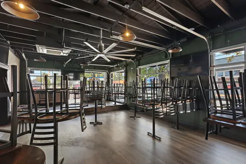 a view of a livingroom with furniture and chandelier