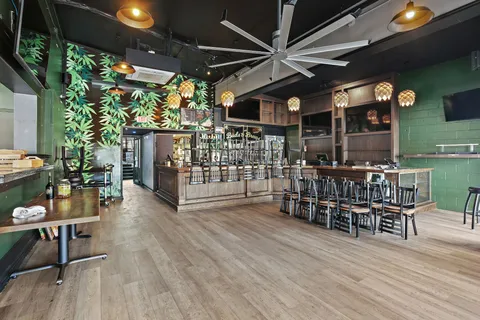 a room with pool table and window