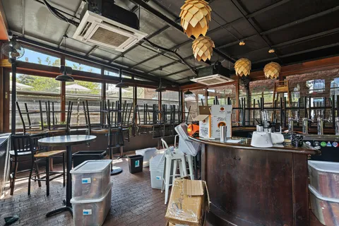 a utility room with dryer washer and other items