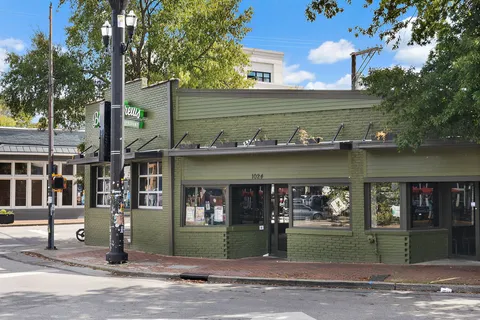 a view of a brick building with many windows