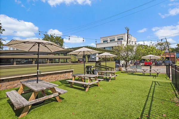 a view of a chairs and table in patio