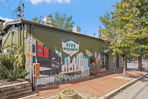 a view of a street with sitting area