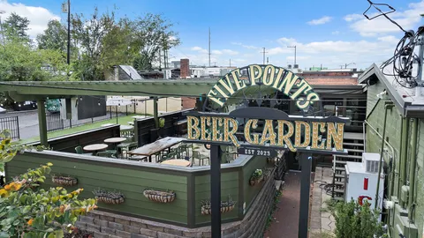 a view of a parked cars park in front of building