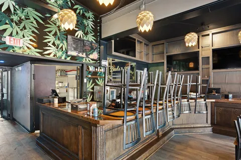 a room with lots of wooden furniture and a chandelier
