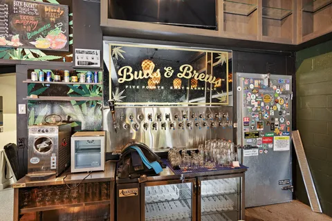 a view of a chairs and table in a room with wooden floor