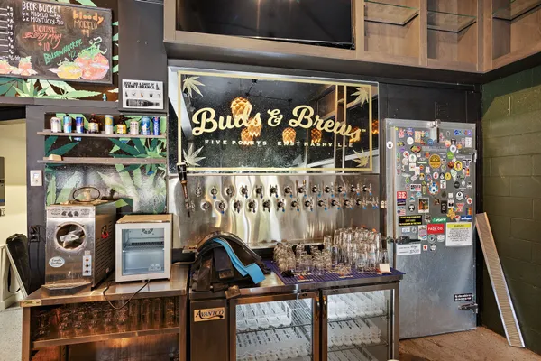 a view of a chairs and table in a room with wooden floor