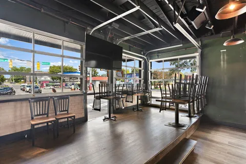 a view of a room with wooden floor