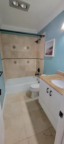 a kitchen with stainless steel appliances granite countertop a sink and a refrigerator