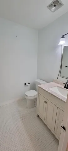 a kitchen with a counter top stove and sink