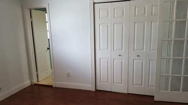 a bathroom with a granite countertop sink and mirror