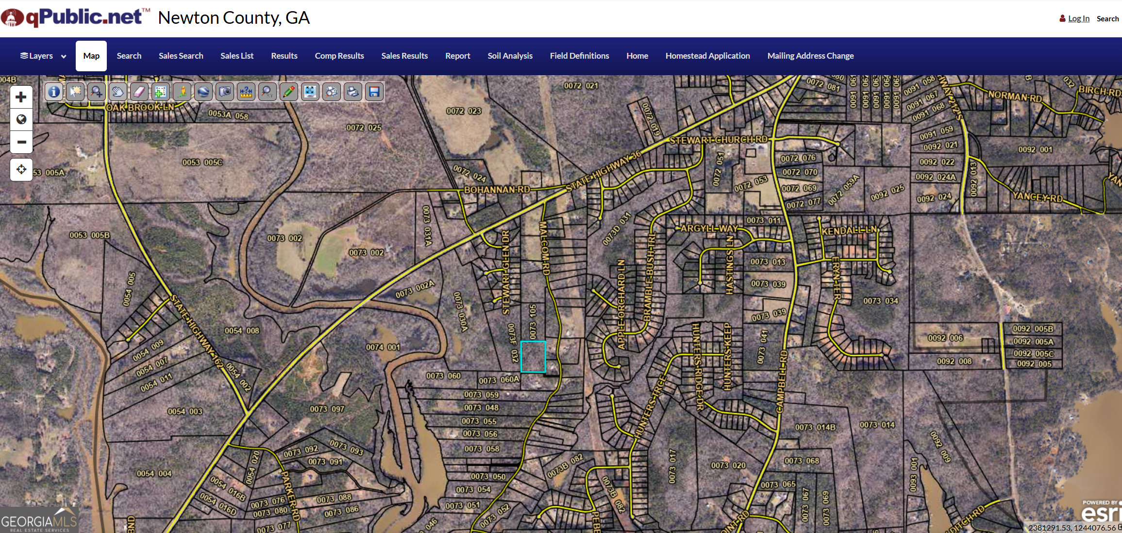 0 Malcom Road Covington, GA 30014 - Photo 5 of 5 a view of a red building with a street
