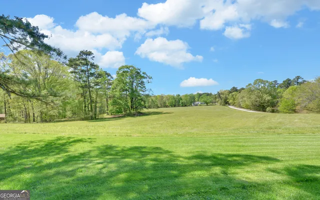 a view of a house with a street