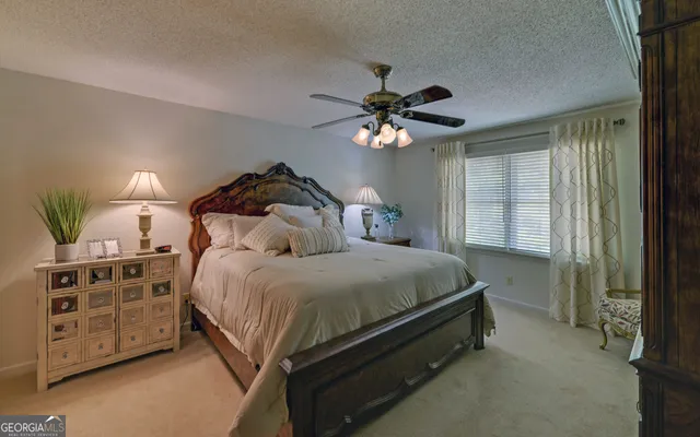 a view of walk in closet with clothes