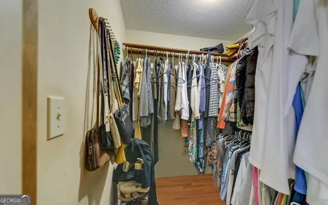 a bathroom with a sink a mirror and a shower