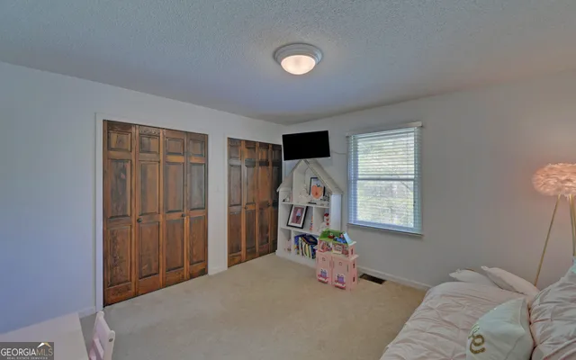 a view of balcony with wooden floor and fence