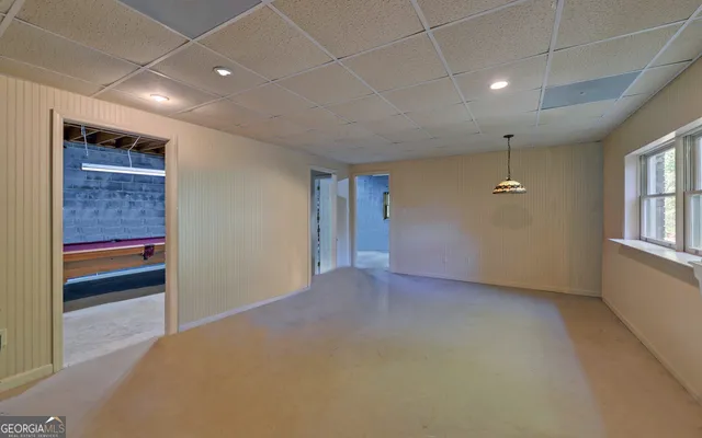 a view of a road with a house in the background