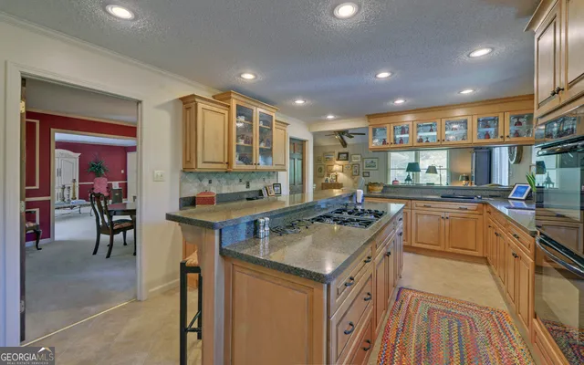 a living room with furniture and a lamp