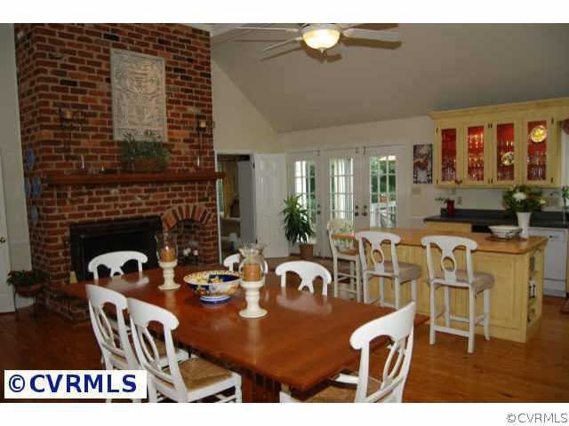 10814 Weather Vane Road Richmond, VA 23238 - Photo 3 of 10 Other - Kitchen features floor-to-ceiling woodburning brick fireplace