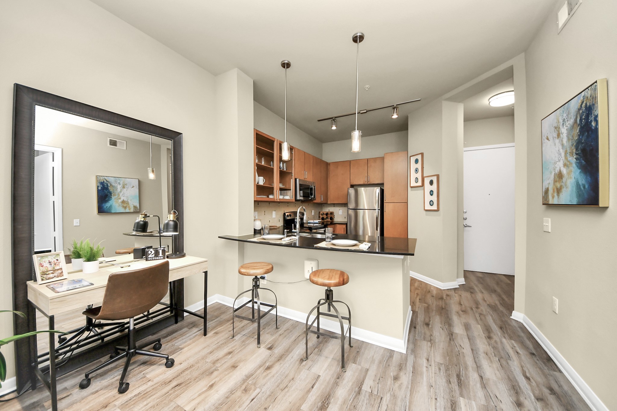 5455 Richmond Avenue, Unit 4086 Houston, TX 77056 - Photo 41 of 50 a view of a dining room and livingroom with furniture wooden floor a chandelier