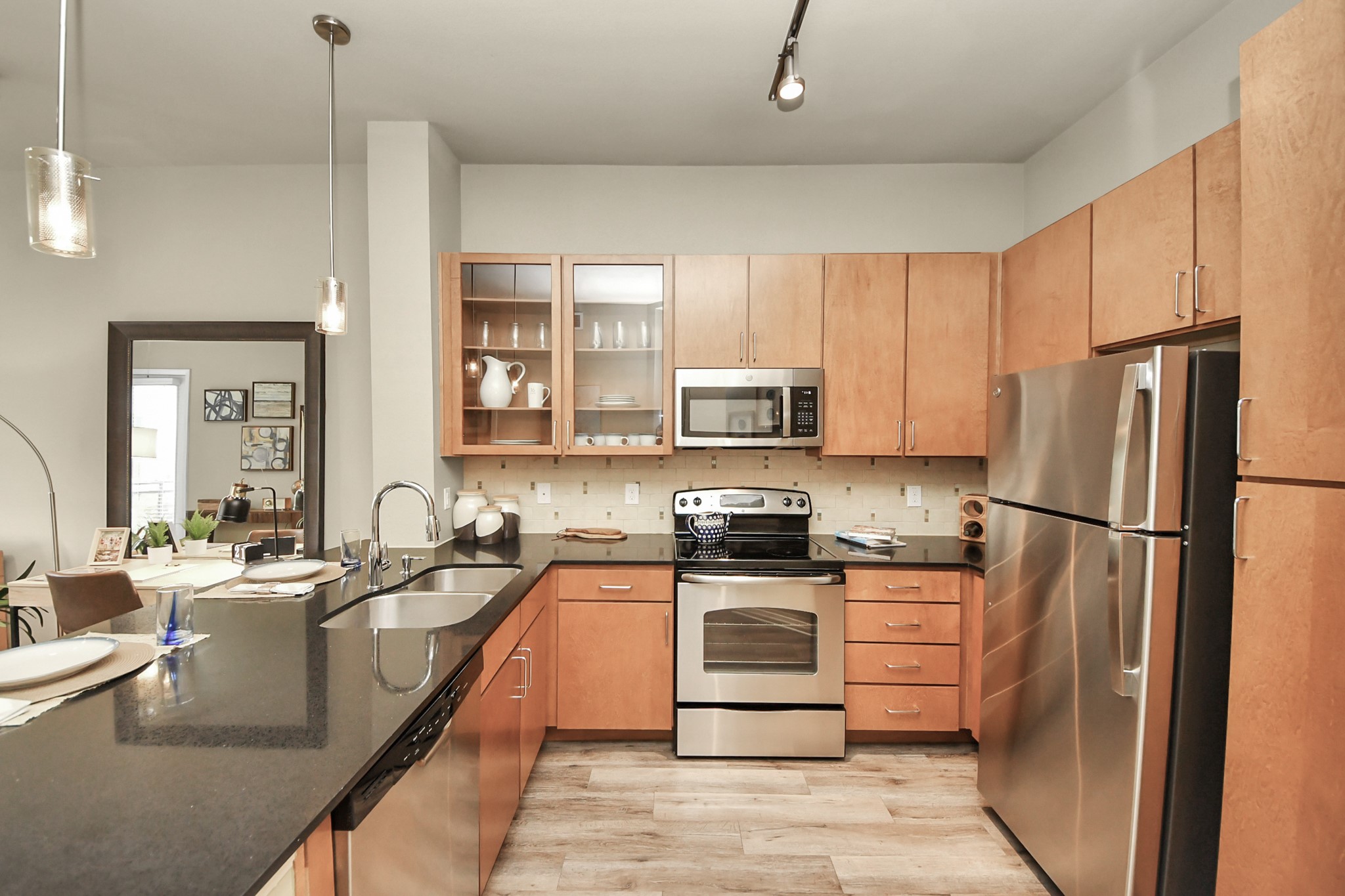 5455 Richmond Avenue, Unit 4086 Houston, TX 77056 - Photo 29 of 50 a kitchen with stainless steel appliances a refrigerator sink and microwave