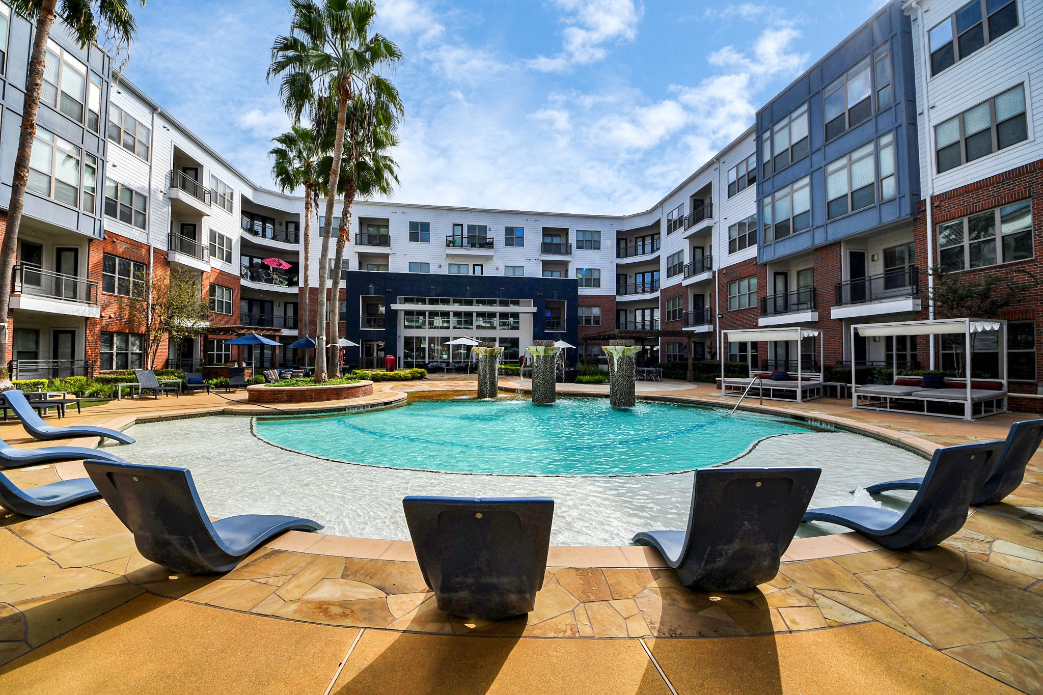 5455 Richmond Avenue, Unit 4086 Houston, TX 77056 - Photo 20 of 50 a view of a swimming pool with a lounge chairs