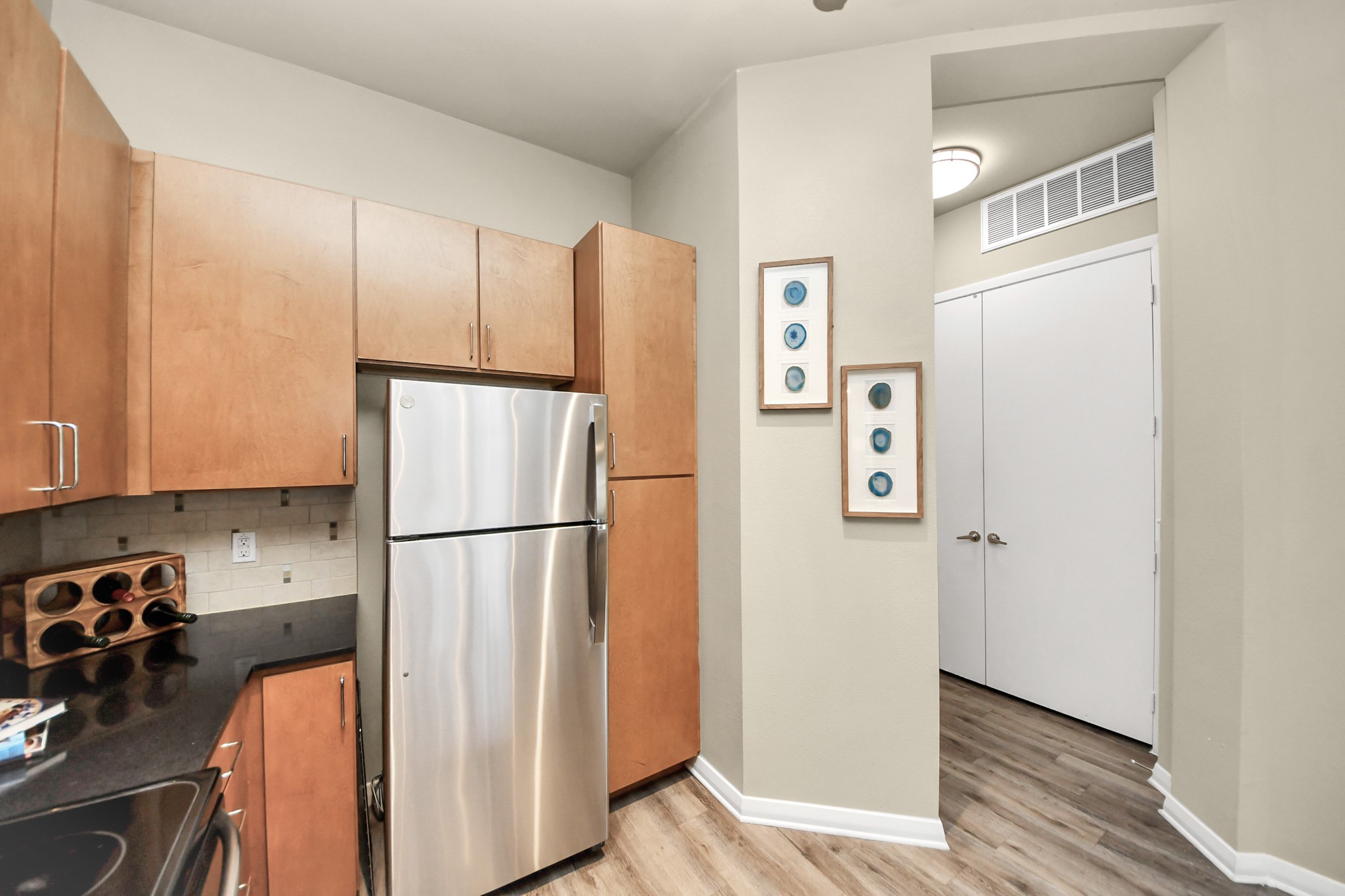 5455 Richmond Avenue, Unit 4086 Houston, TX 77056 - Photo 34 of 50 a white refrigerator freezer sitting in a kitchen