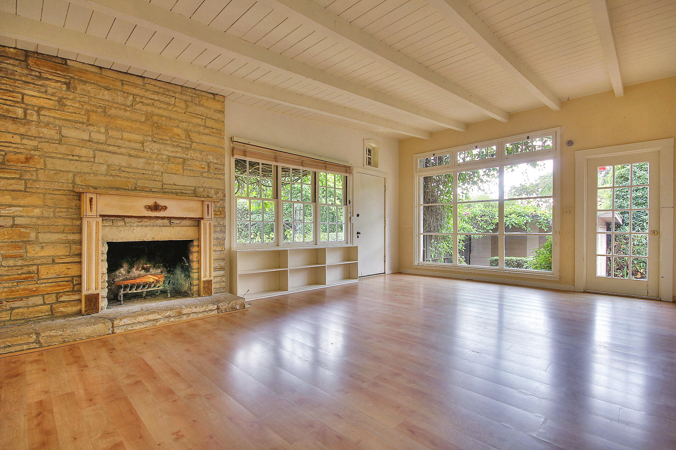 145 Hermosillo Road Santa Barbara, CA 93108 - Photo 3 of 22 a view of an empty room with a fireplace and a window