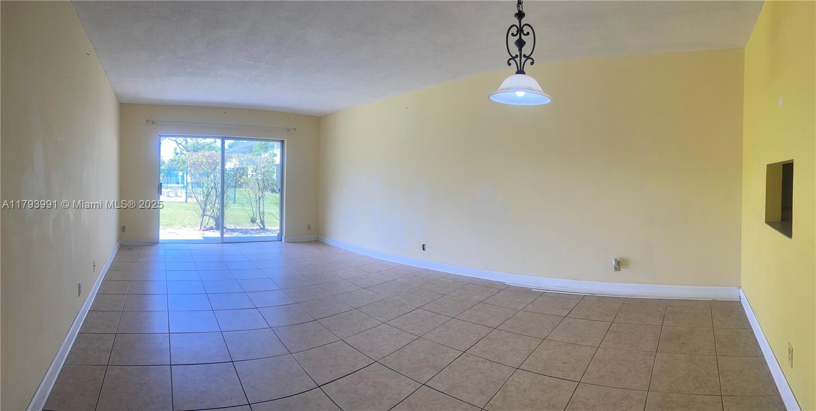 4200 Northwest 3rd Court, Unit 134 Plantation, FL 33317 - Photo 12 of 15 a view of empty room with wooden floor and fan