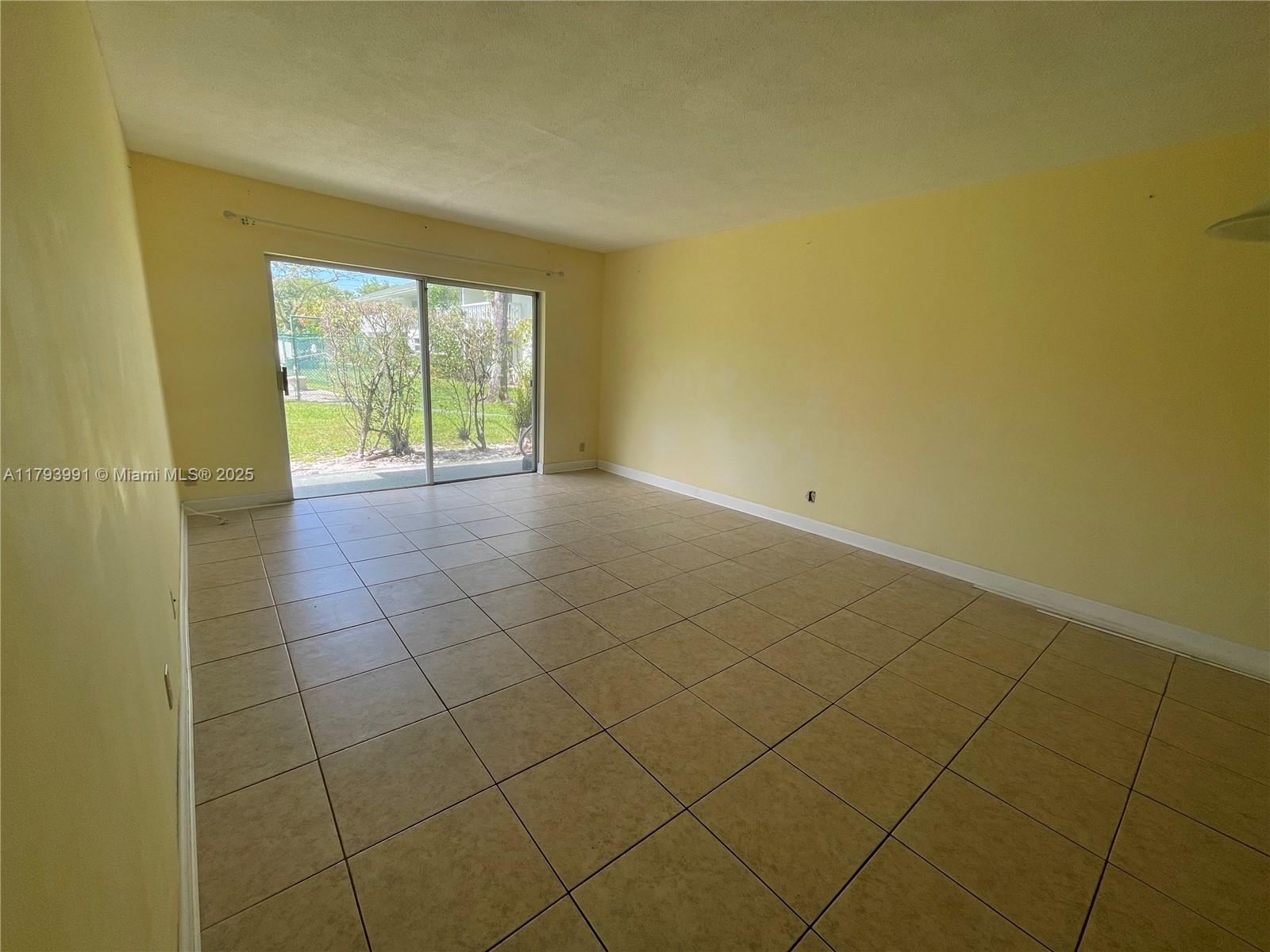 4200 Northwest 3rd Court, Unit 134 Plantation, FL 33317 - Photo 3 of 15 a view of an empty room with a window