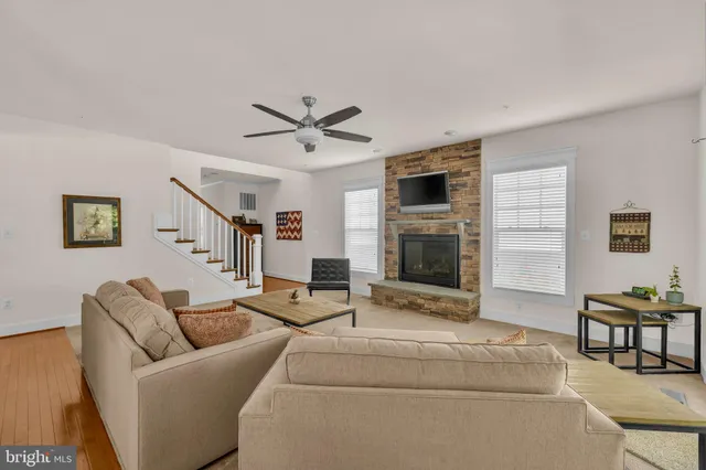 a kitchen with stainless steel appliances granite countertop a sink and a refrigerator