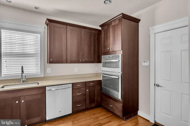 a kitchen with a table and chairs