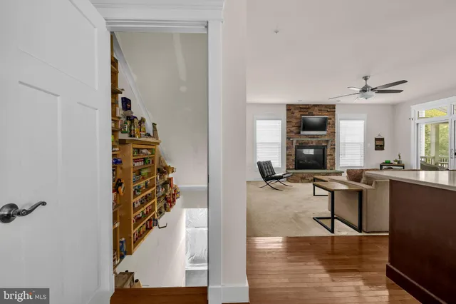 a dining room with furniture and wooden floor