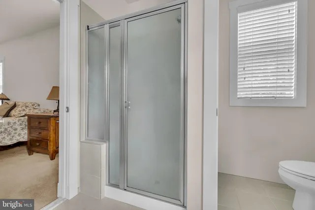 a view of a livingroom with a couch and a large window