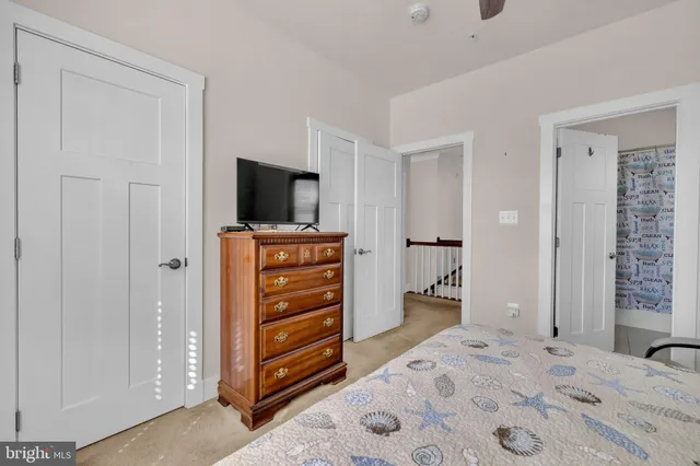 a bathroom with a sink a toilet and a window