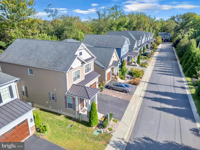 a aerial view of a house with a yard
