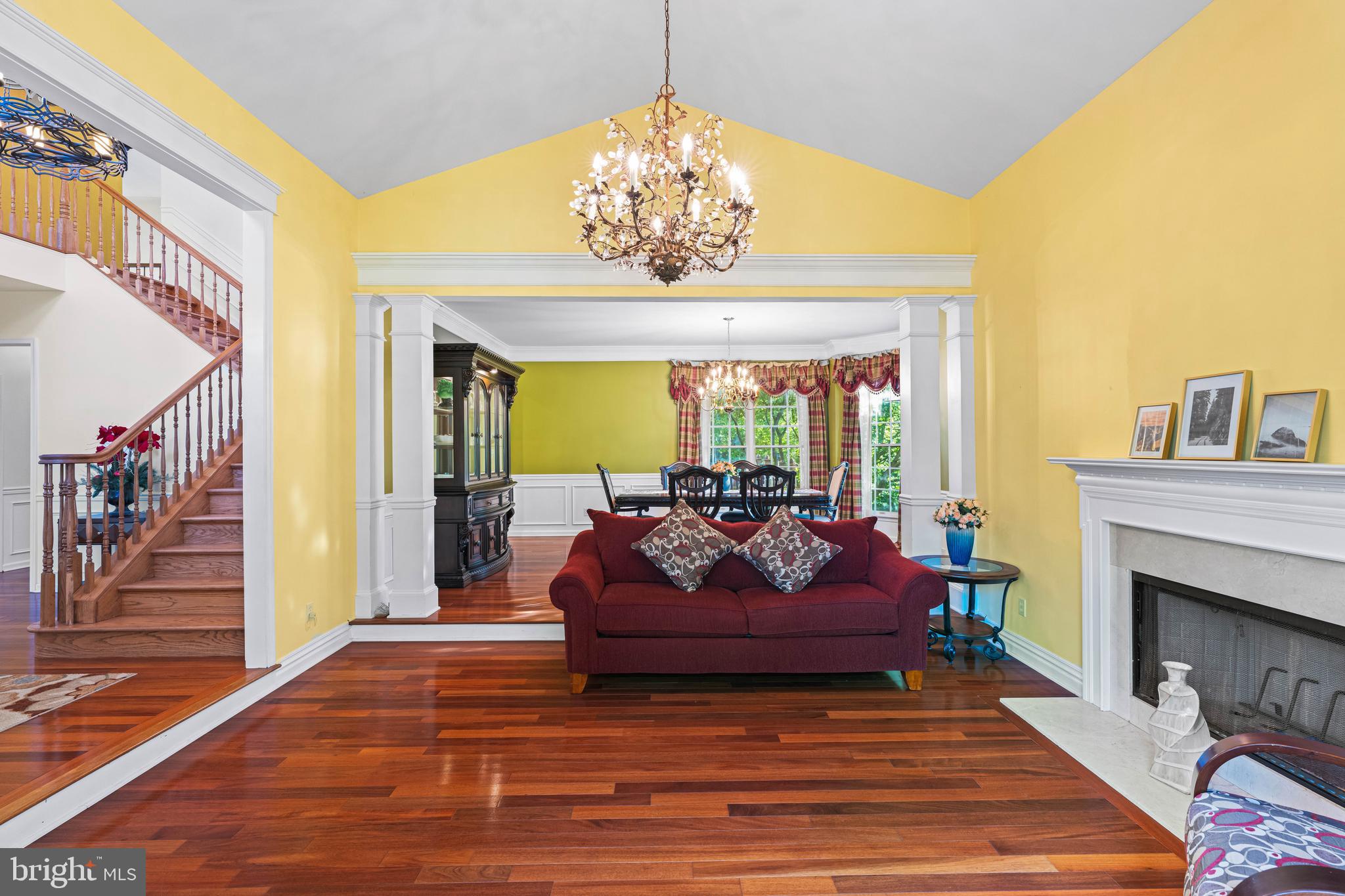 6 Howell Court Princeton Junction, NJ 08550 - Photo 20 of 81 a living room with furniture chandelier and a fireplace